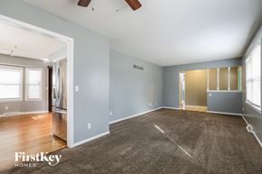 Kansas City house for rent - the living room and dining room of an empty house