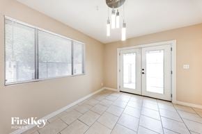 Glendale house for rent - a large living room with a large window and a chandelier