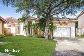 Cutler Bay house for rent - A house with a tree in front of it.