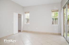 Cutler Bay house for rent - A spacious room with a sliding glass door leading to a balcony.