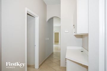 Cutler Bay house for rent - A white kitchen with a sink and cabinets.