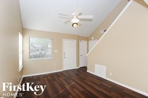 Fort Worth house for rent - a living room with hardwood floors and a ceiling fan