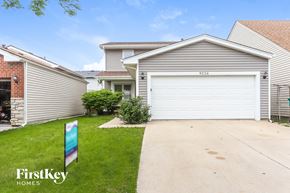 Orland Hills house for rent - A house with a garage door numbered 9216 is for sale.
