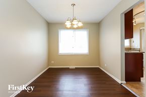 Orland Hills house for rent - A room with wooden floors and a window.