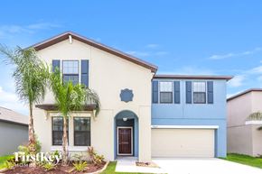 Ruskin house for rent - a house with a palm tree in front of it