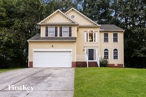 Charlotte house for rent - A two-story house with a garage is for sale.