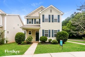 Huntersville house for rent - A two-story house with a front yard and a sign that says "FirstKey Homes".