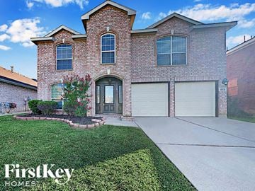 Fort Worth house for rent - a brick house with a sidewalk in front of it