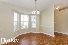 Cutler Bay house for rent - the dining room and living room with hardwood flooring and windows