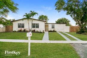 Cutler Bay house for rent - a white house with a mailbox in front of a lawn
