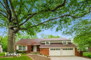 Overland Park house for rent - a house with a large tree in front of it