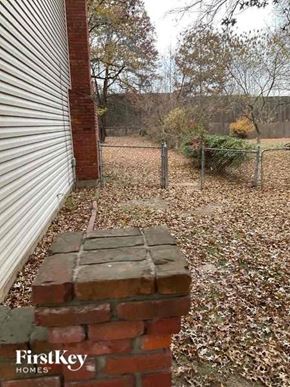 Overland Park house for rent - a brick wall sitting next to a building