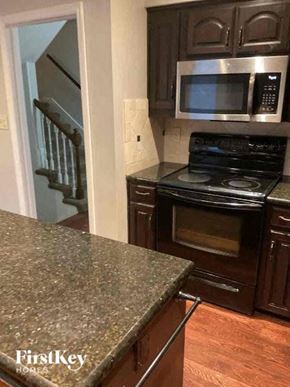 Overland Park house for rent - a kitchen with a stove and a microwave