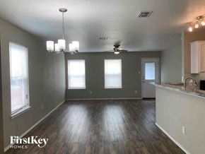 Dallas house for rent - an empty living room and kitchen in a house