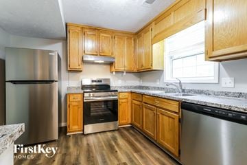 Canton house for rent - A kitchen with wooden cabinets and stainless steel appliances.