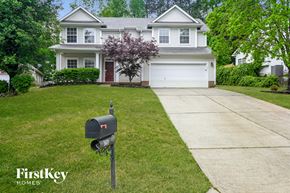 Charlotte house for rent - a house with a mailbox on the sidewalk in front of it