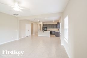 Jacksonville house for rent - A spacious living room with a kitchen area in the background.