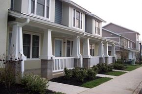 Seabrook apartment for rent - a row of houses with white pillars and a sidewalk