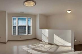 Seabrook apartment for rent - an empty living room with a fireplace and a large window
