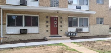 Milwaukee apartment for rent - the front of a brick house with a red door