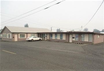 Yakima apartment for rent - A white car is parked in front of a building.