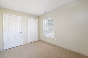 Peoria apartment for rent - an empty bedroom with two doors and a window