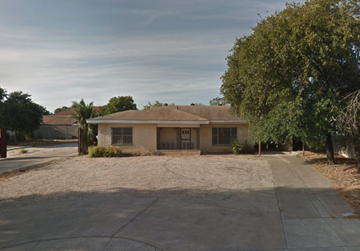 Laredo apartment for rent - a house with a driveway and a tree