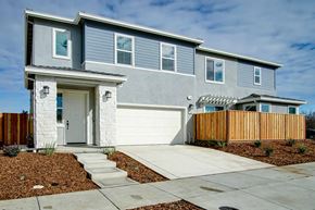 Hollister apartment for rent - a blue house with a sidewalk in front of it