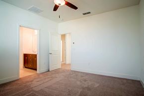 Hollister apartment for rent - a room with a carpeted floor and a ceiling fan