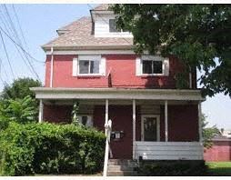 Pittsburgh apartment for rent - a red house with a white porch and a tree