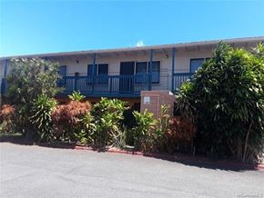 Honolulu apartment for rent - a building with a balcony and some plants