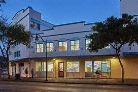 Honolulu apartment for rent - a building on a city street at night