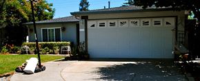 San Jose house for rent - A white garage door is closed.