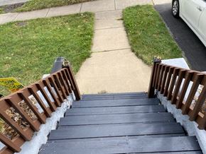 Buffalo apartment for rent - A wooden staircase with a railing on both sides.