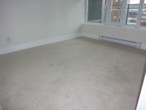 Vancouver apartment for rent - A room with a window and a radiator on the wall.