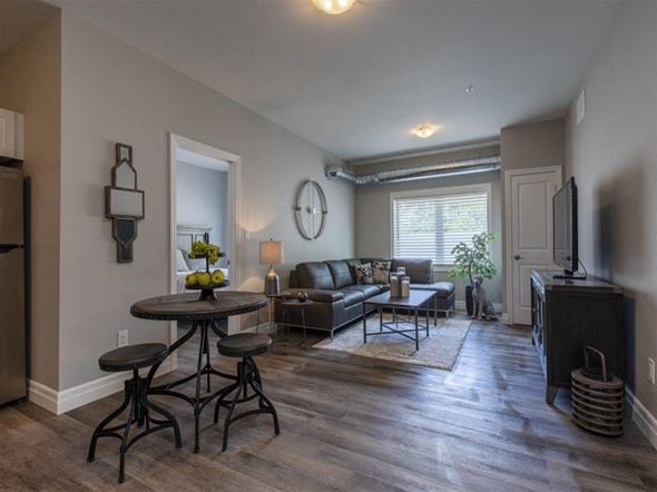 Kingston apartment for rent - a living room with a couch and a table