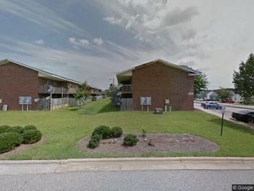 Rocky Mount apartment for rent - a building on the side of a street with a lawn