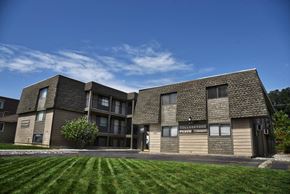 Spokane apartment for rent - a building with a green lawn in front of it