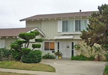 San Diego house for rent - a white house with a tree in front of it