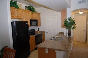 Sierra Vista apartment for rent - a kitchen with a black refrigerator and a sink