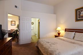 Sierra Vista apartment for rent - a bedroom with a bed and a door to a bathroom