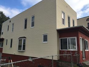 Omaha apartment for rent - a house with a fence in front of it