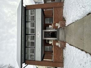 Omaha apartment for rent - a view of a building from the outside in the snow