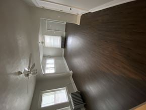 Omaha apartment for rent - an overhead view of a room with a window and a ceiling fan
