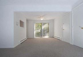 Foxboro apartment for rent - an empty living room with a door to a balcony