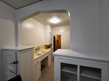Alameda apartment for rent - A kitchen with white cabinets and a sink.