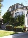 Alameda apartment for rent - A house with a white front and a grey roof.