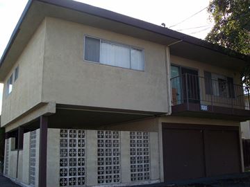 Alameda apartment for rent - A two-story house with a balcony on the second floor.