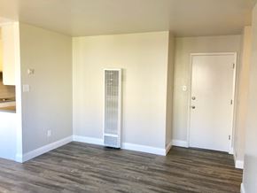Oakland apartment for rent - A room with a white door and a window with blinds.