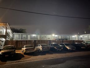 Killeen apartment for rent - a row of cars parked in front of a building at night